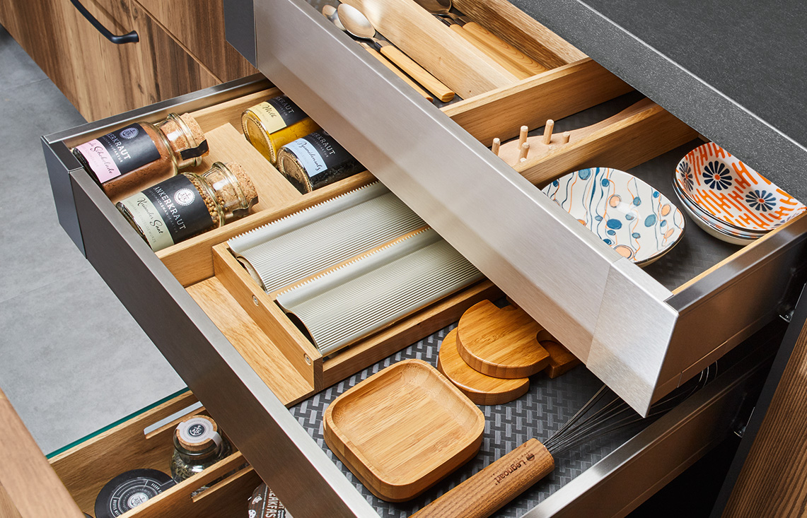 Kitchen drawer organisation with timber compartments